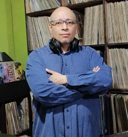 A side view of a plate of figs and berries.